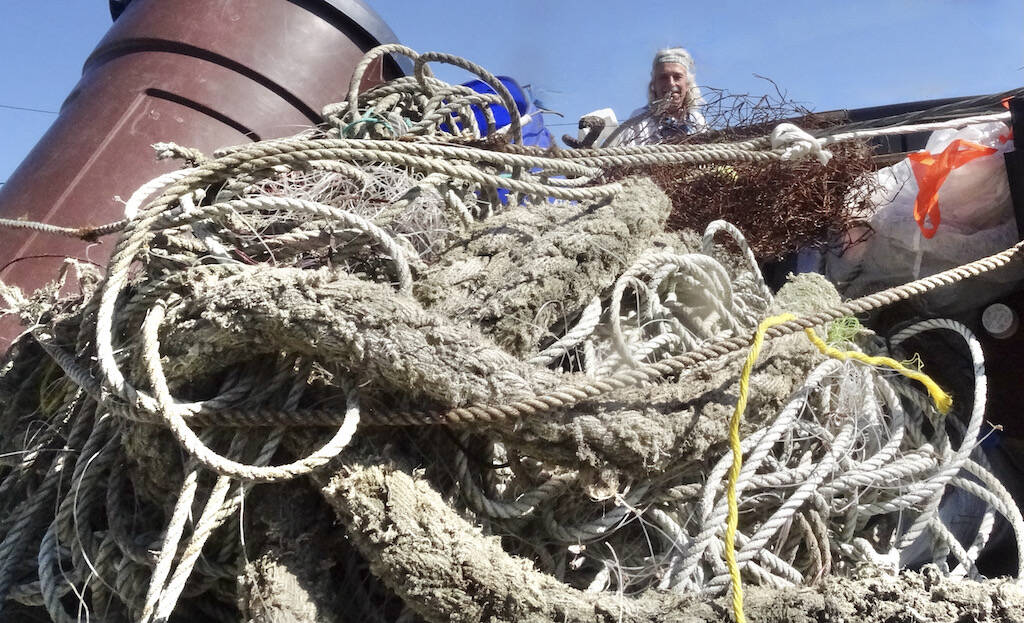 Roy Morris with collected marine debris from last spring’s clean-up. Submitted Photo