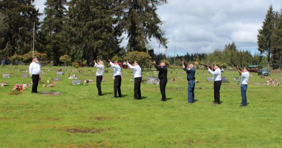 Members of American Legion Post 106 offer a 21 gun salute at the Forks Cemetery on Monday. Photos Christi Baron