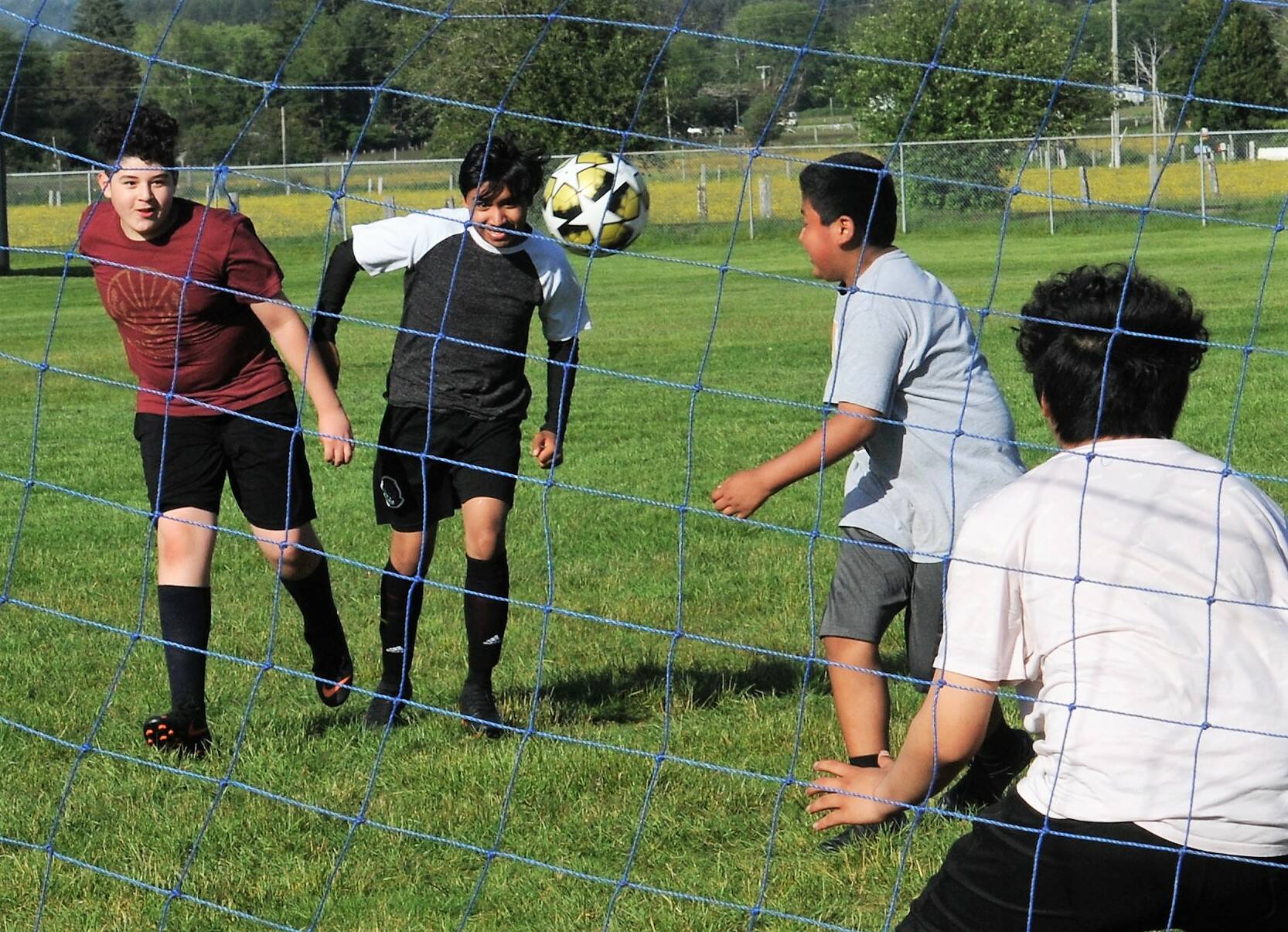Not to be confused with the Red Dragons, the 10 to 14-year-old Dragons were having fun in the sun as they prepared for the soccer season. Photo by Lonnie Archibald.