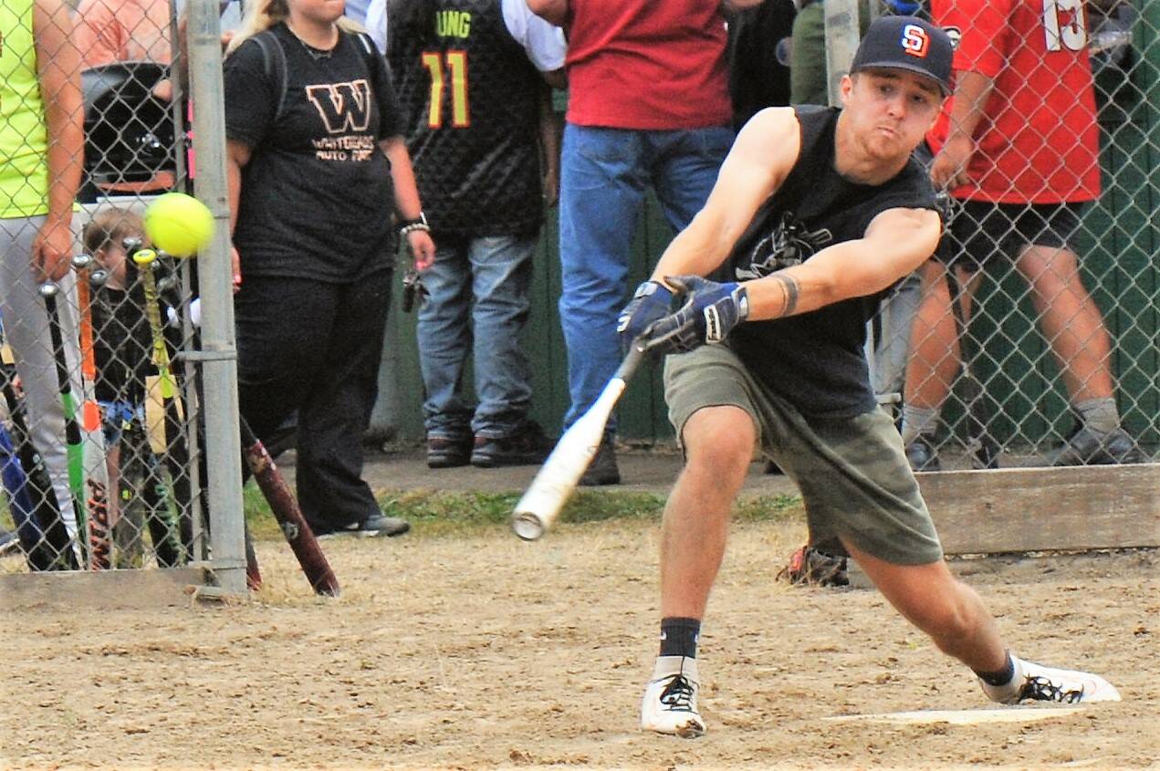 Team Gramps hitter Logan Olson connects against the Forks Merchants. The Merchants took this contest 15 to 8. Team Gramps made a comeback, however, to place second in the tournament.