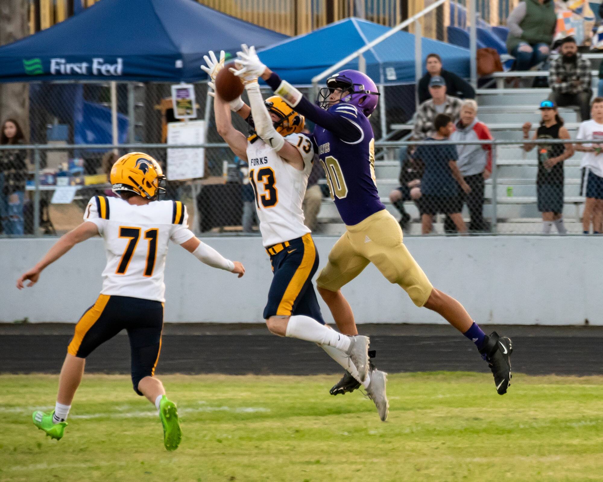 Ryan Rancourt #13 going up for the ball with Kaleb Blanton #71.