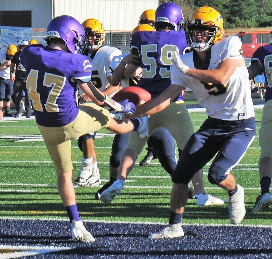 Spartan Landin Davis (5) partially blocks this Sequim punt as pressure is applied by the Spartans during this shutout against the Wolves. Photo by Lonnie Archibald