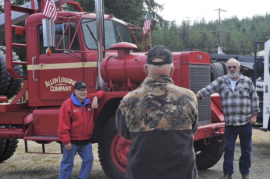 Rene Davis takes time to photograph Don Adams (left) and Howard Goakey in front of the old Allen’s 1966 KW off-highway log truck. Howard drove for Lloyd Allen for a short time but spent many years loading for him while Don told of driving the old truck down the steep logging road from Owl Mountain on the upper Hoh where you didn’t dare lose your air brakes.