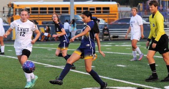 Spartan Tanya Olivera Barragan kicks against Ilwaco who Forks defeated 1 to 0. Also in the action is Flora Horejsi. Photo by Lonnie Archibald