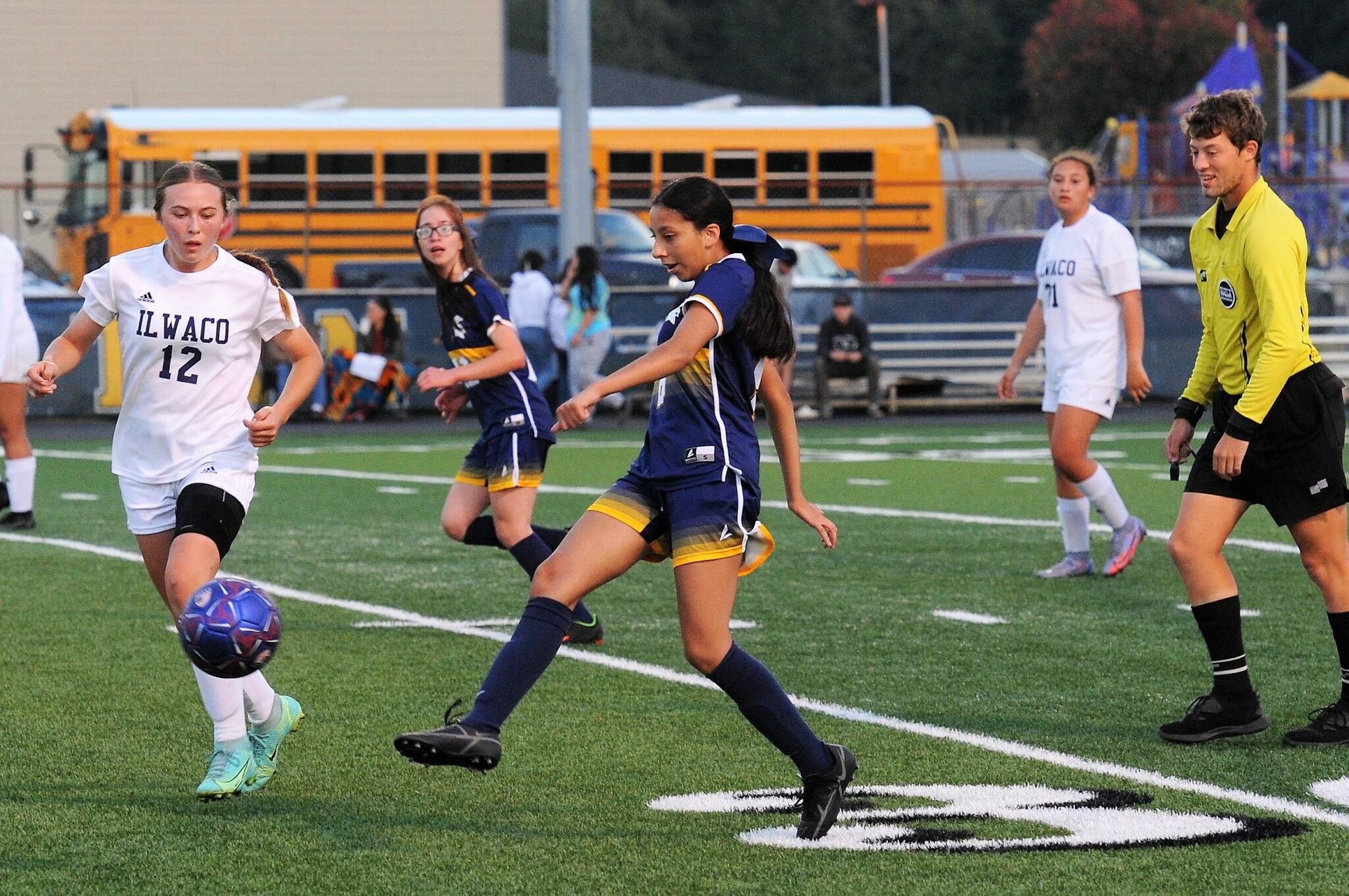 Spartan Tanya Olivera Barragan kicks against Ilwaco who Forks defeated 1 to 0. Also in the action is Flora Horejsi. Photo by Lonnie Archibald