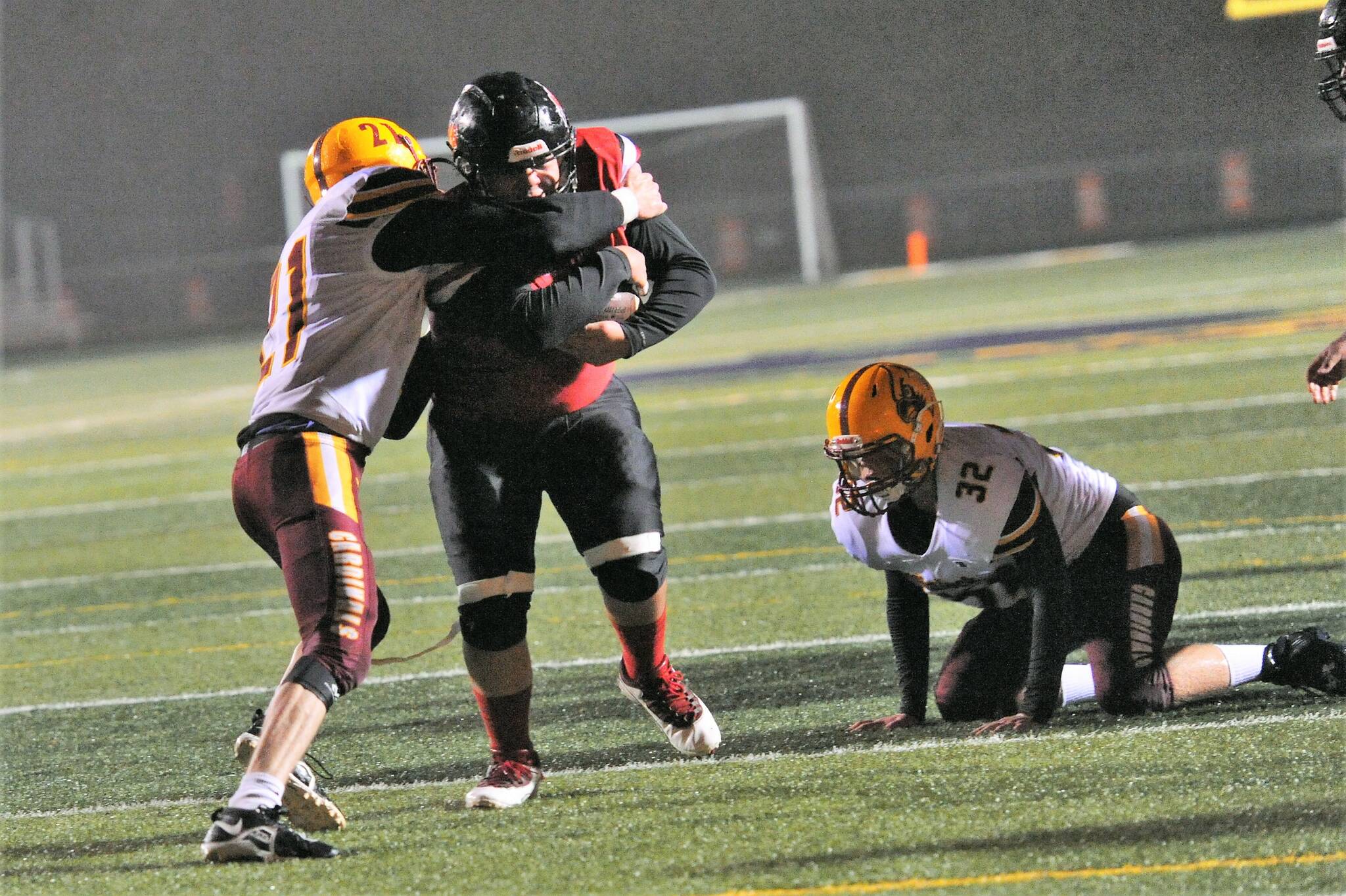 Neah Bays’ freshman running back Charles Halttunen scores a TD as he runs through Winlock defenders. Photo by Lonnie Archibald