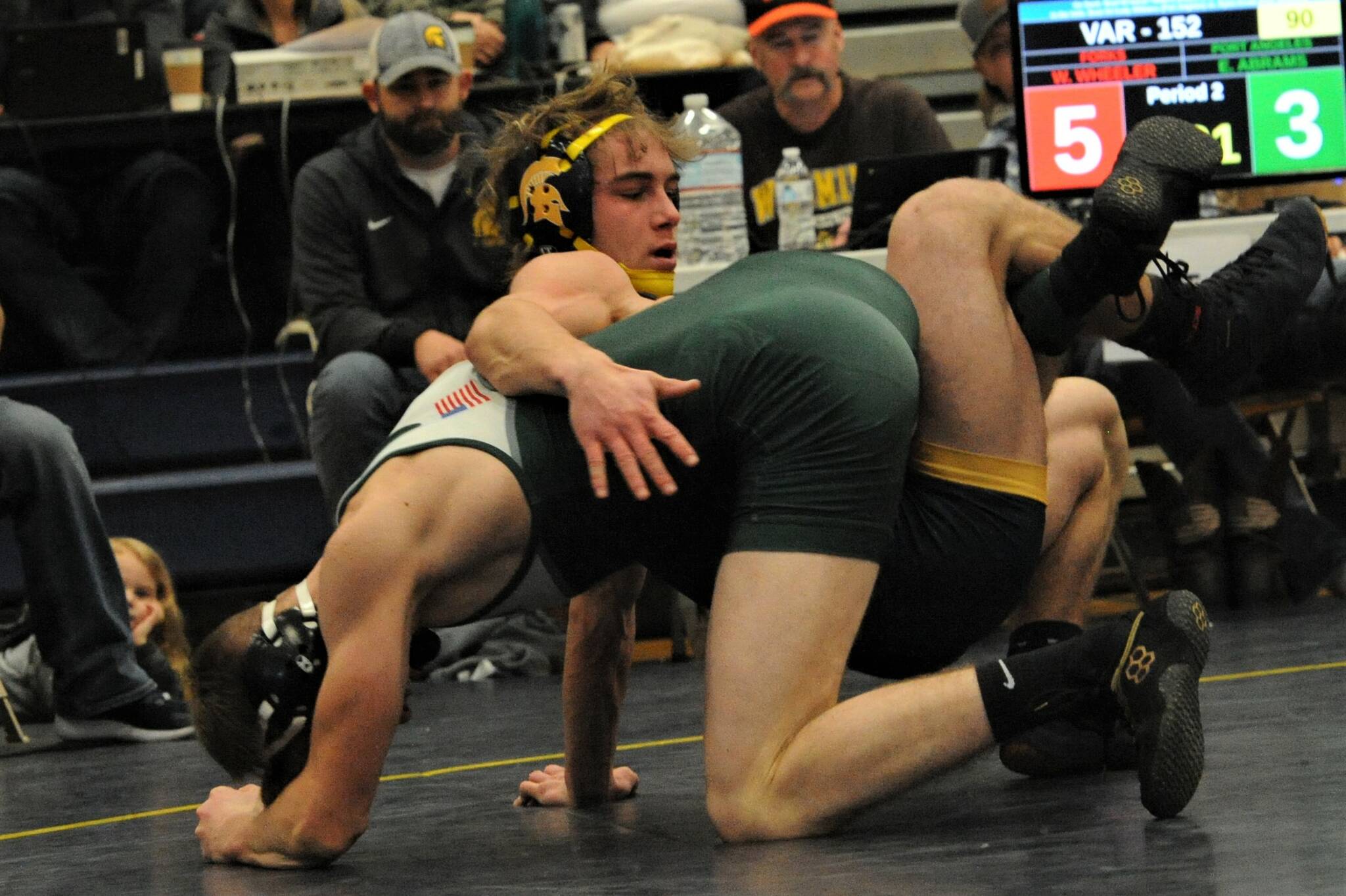 Spartan Walker Wheeler (top) defeated Abrams of Port Angeles 11 to 6 in the 152 lb class.