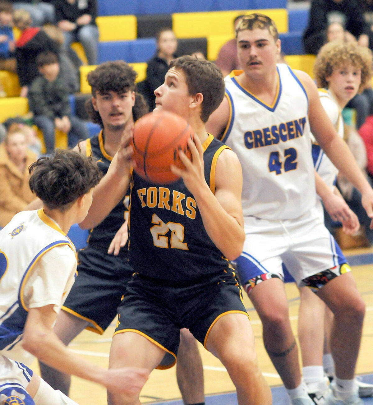 Forks’ Brody Lausch, center, looks for an opening surrounded by, clockwise from left, Terrell Emery of Crescent, LandinDavis of Forks, and Conner Ferro-May and Henry Bourm of Crescent on Wednesday in Joyce. (Keith Thorpe/Peninsula Daily News)