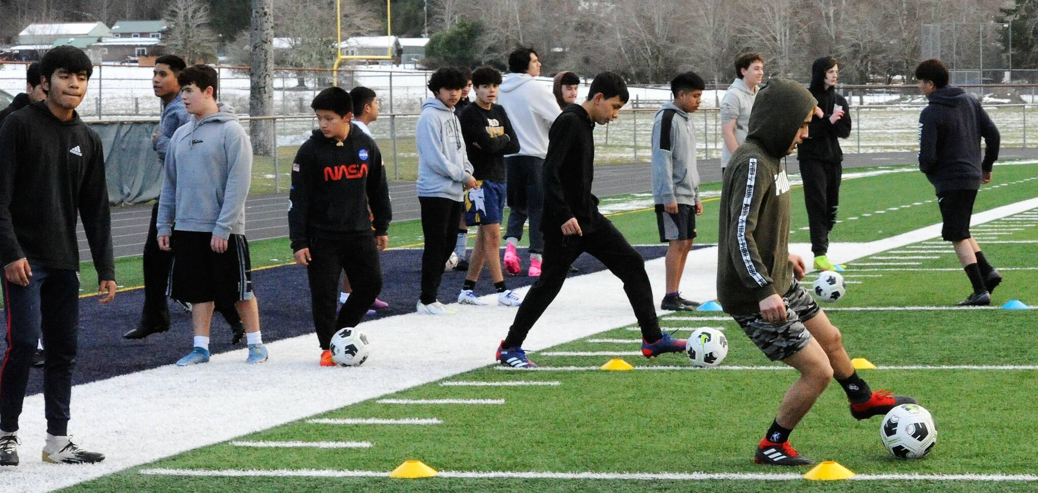 Even with very cool temperatures at Spartan Stadium, 30 Forks high school athletes were getting a real kick out of soccer as they prepared for the upcoming season. Photo by Lonnie Archibald