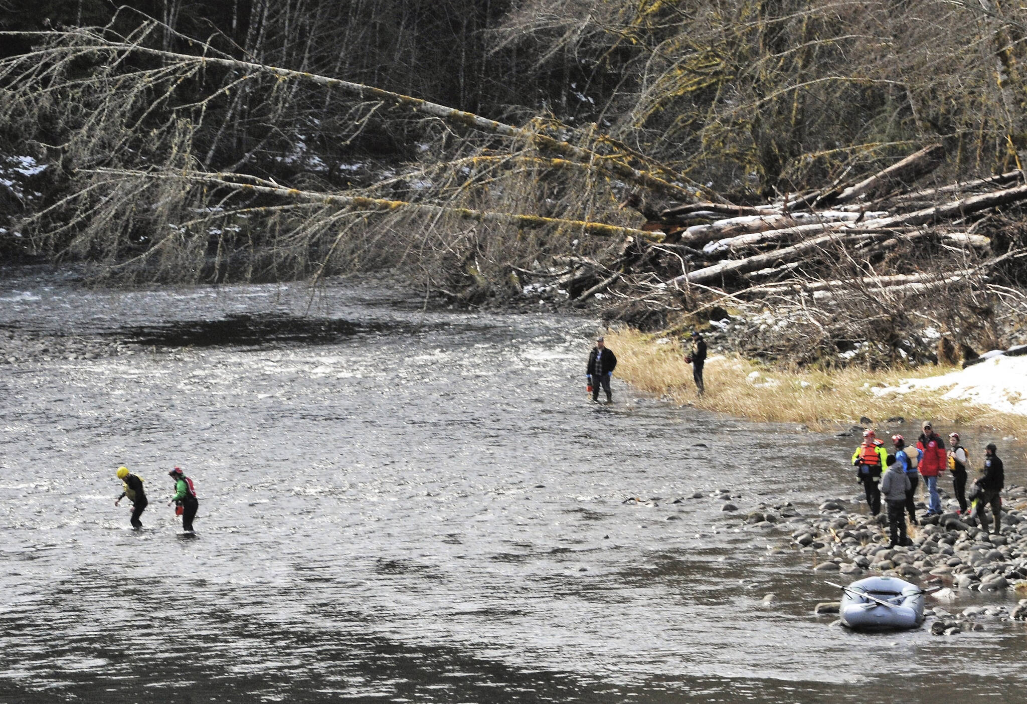 Rescuers enter the Sol Duc River Sunday morning. Photo by Lonnie Archibald