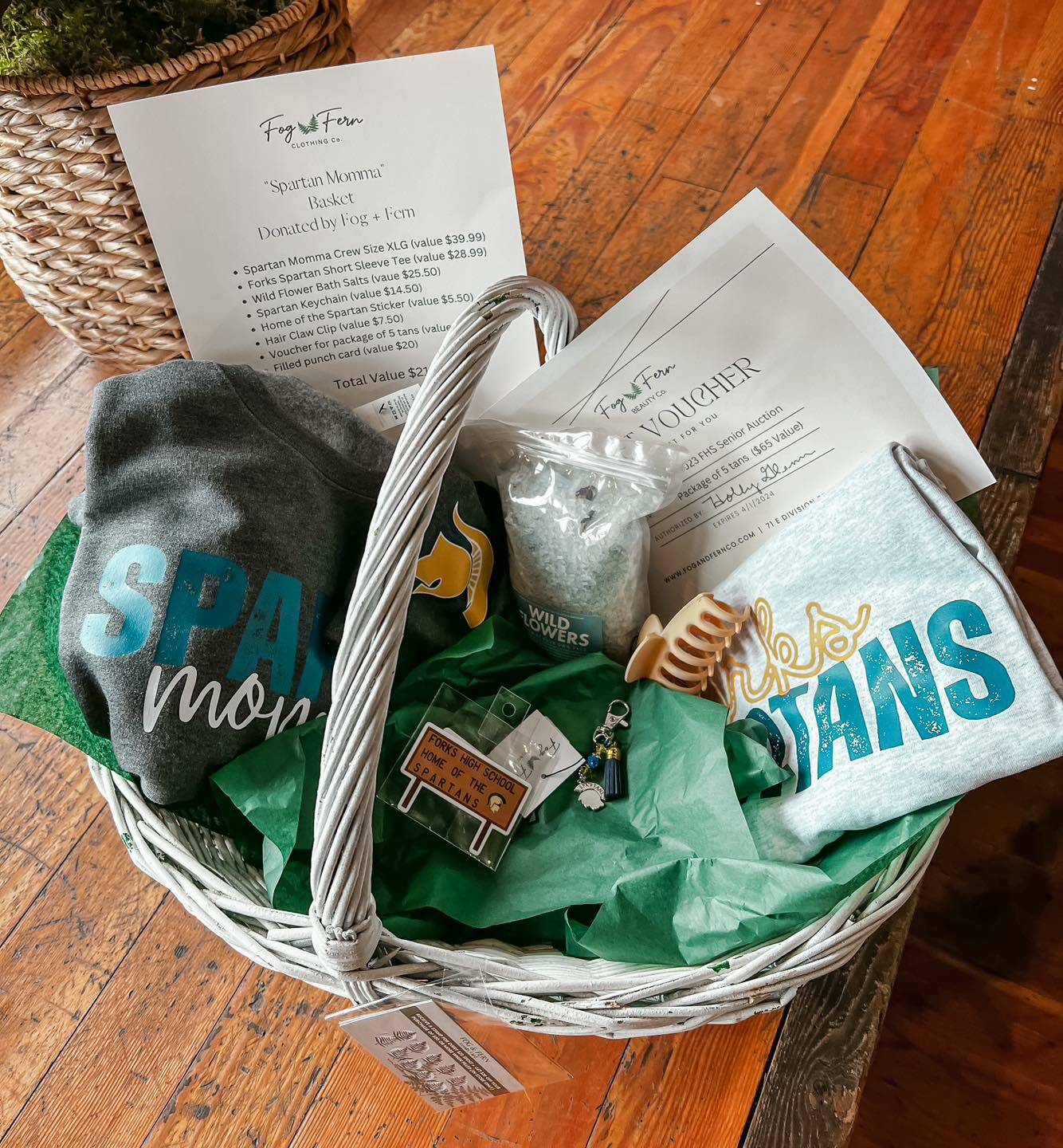 Many local businesses like Fog and Fern Clothing Co., who donated this basket, have generously donated amazing items for this weekend’s fundraiser benefiting Forks graduates.