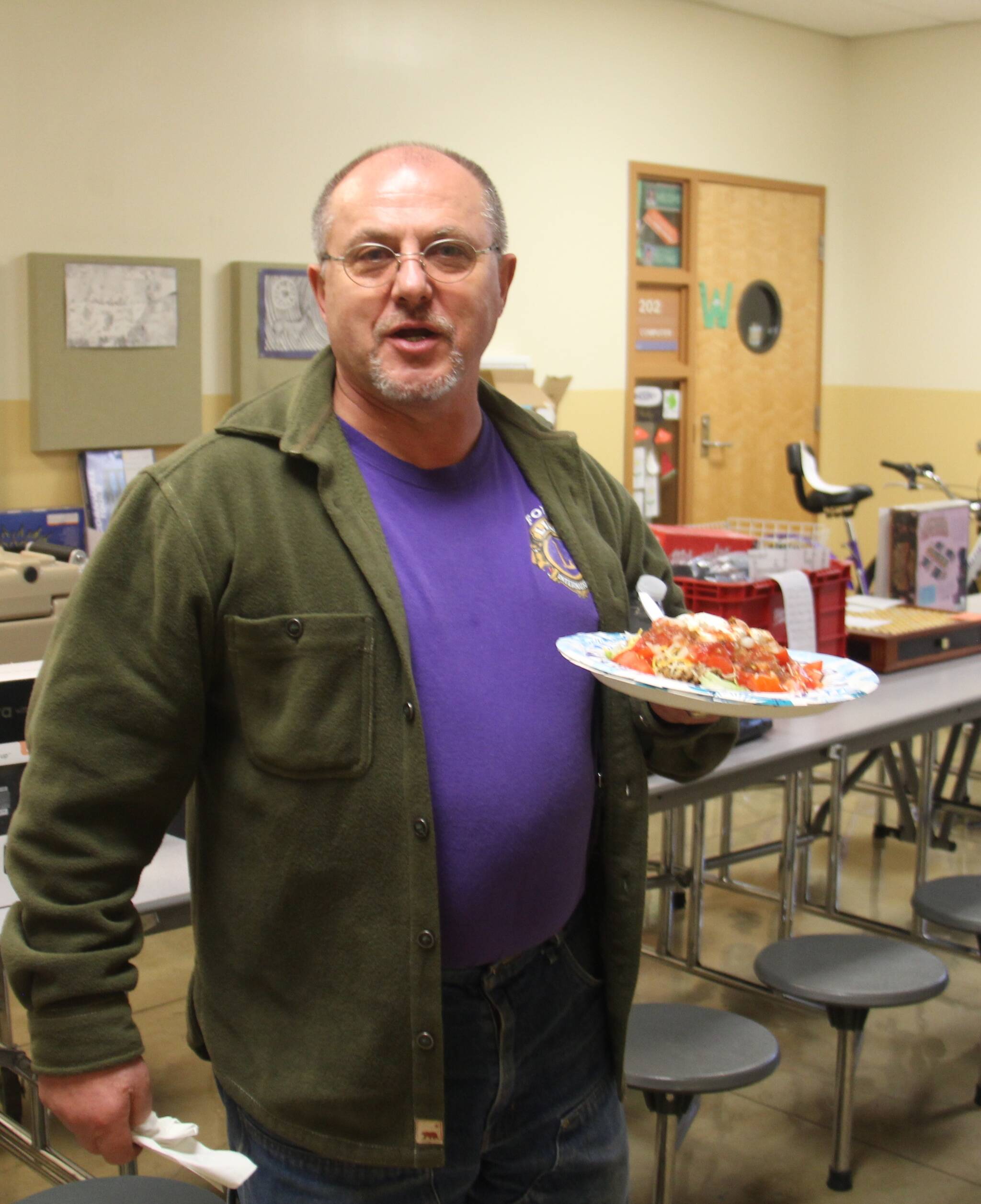 Giancarlo Buonpane was keeping his strength up to bid more with a delicious plate of food from the senior parent concessions stand. Photo Christi Baron