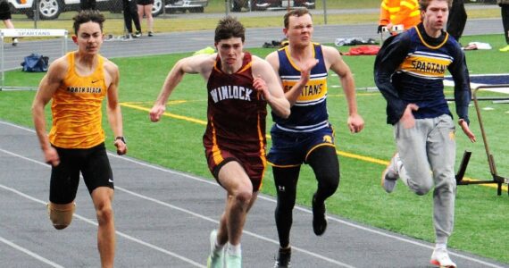 Ryan Anderson and Isaac Gonzales in the 100-yard dash. Photo by Lonnie Archibald