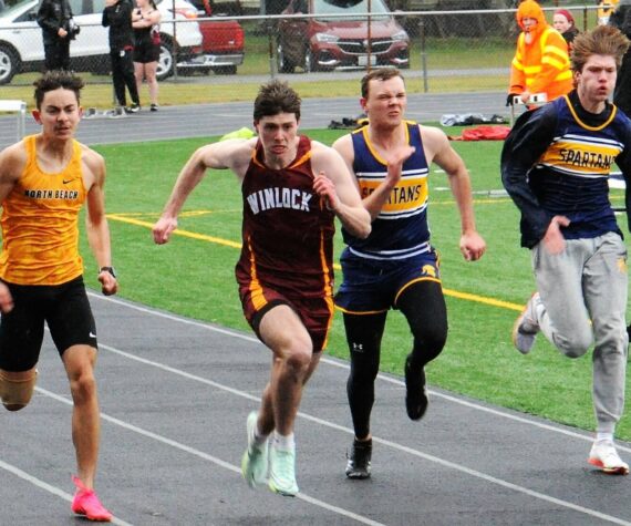 Ryan Anderson and Isaac Gonzales in the 100-yard dash. Photo by Lonnie Archibald