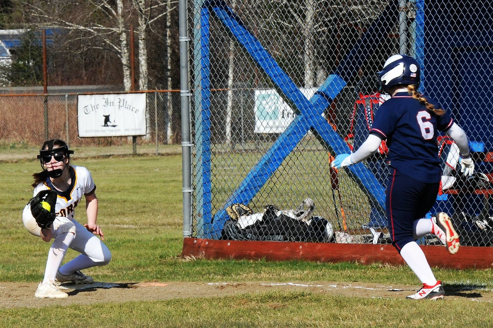 Second baseman Bailey Johnson covers first base for the out on a bunt attempt.