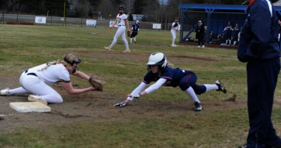 Kadie Wood makes the play at third for the out. Photos Lonnie Archibald
