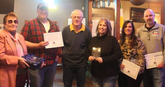 Pictured are - Chamber Executive Director Lissy Andros, Cornerstone Award recipient Nedra Reed, accepting the Halvy Award and representing QVSA are Wes Romberg, Bill Brager, and JoMarie Miller, Citizen of the Year Shelley Castellano, Business of the Year award winner Dean Decker, and Forks Chamber President Trent Thurman. Not pictured Deborah Scannell and Jerry Leppell. Photo Christi Baron