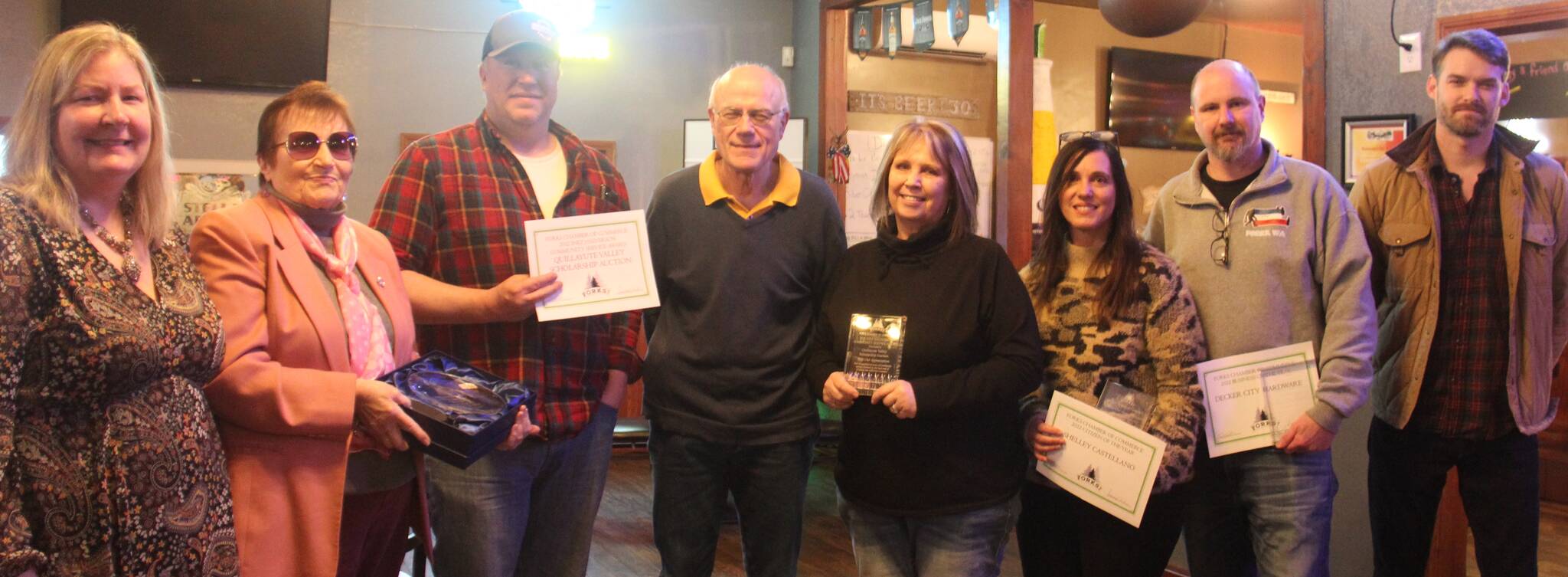 Pictured are - Chamber Executive Director Lissy Andros, Cornerstone Award recipient Nedra Reed, accepting the Halvy Award and representing QVSA are Wes Romberg, Bill Brager, and JoMarie Miller, Citizen of the Year Shelley Castellano, Business of the Year award winner Dean Decker, and Forks Chamber President Trent Thurman. Not pictured Deborah Scannell and Jerry Leppell. Photo Christi Baron