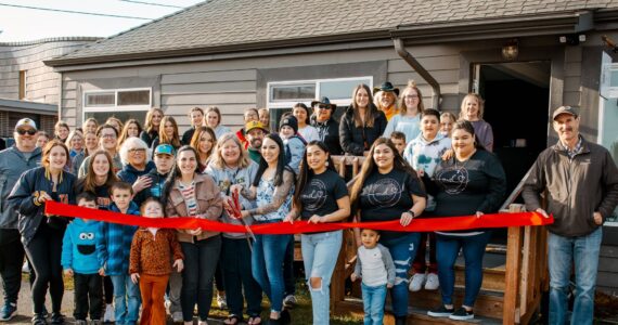 Friends, family, staff, and other Forks business owners recently joined Gwenlyn Gaydeski, in the center with the scissors and Chamber Director Lissy Andros to the left, for a Forks Chamber Ribbon cutting to celebrate the opening of Gwenlyn’s new business, Upper Left Beauty & Wellness Bar. Photo Charlotte Ann Photography