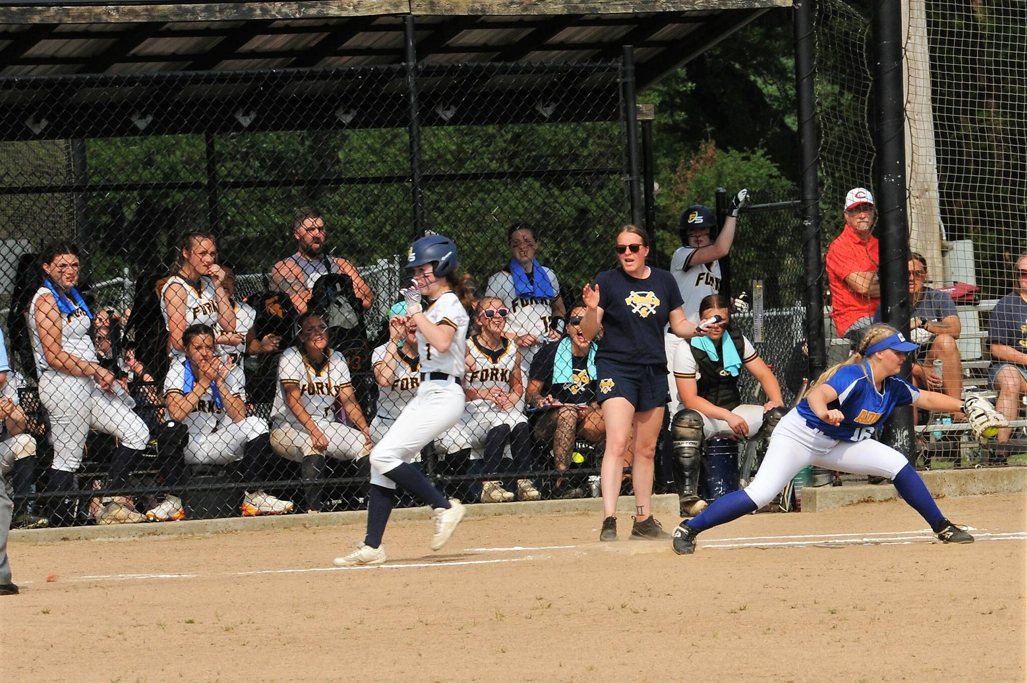Spartan Bailey Johnson beats the throw to first during the Adna game won by Adna 9 to 1.