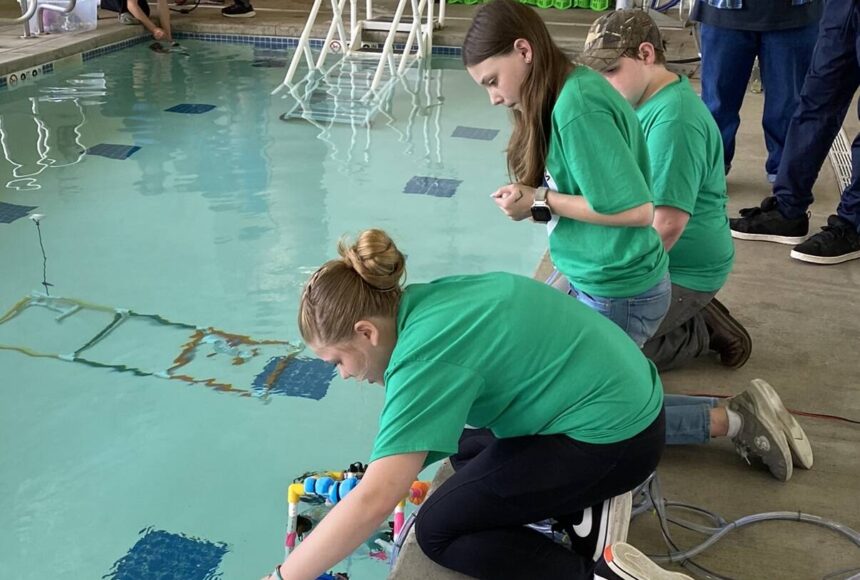 <p>“Forks Whales” team conducts an ROV challenge in the pool.</p>
                                <p>Forks Whales team conducts an ROV challenge in the pool.</p>