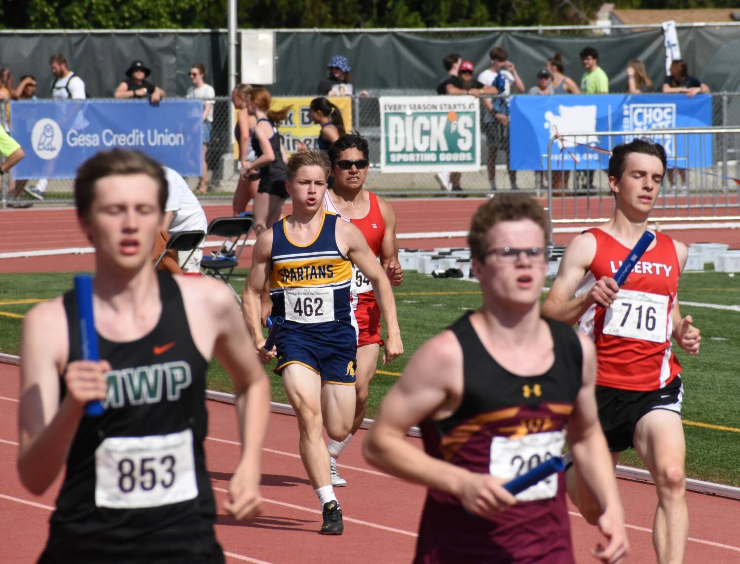 Klaton Helvey, center of photo, competes in the 4x400 at State.
