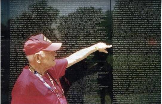 Robert Hall points out Vernon Depew’s name on the Vietnam Memorial Wall.