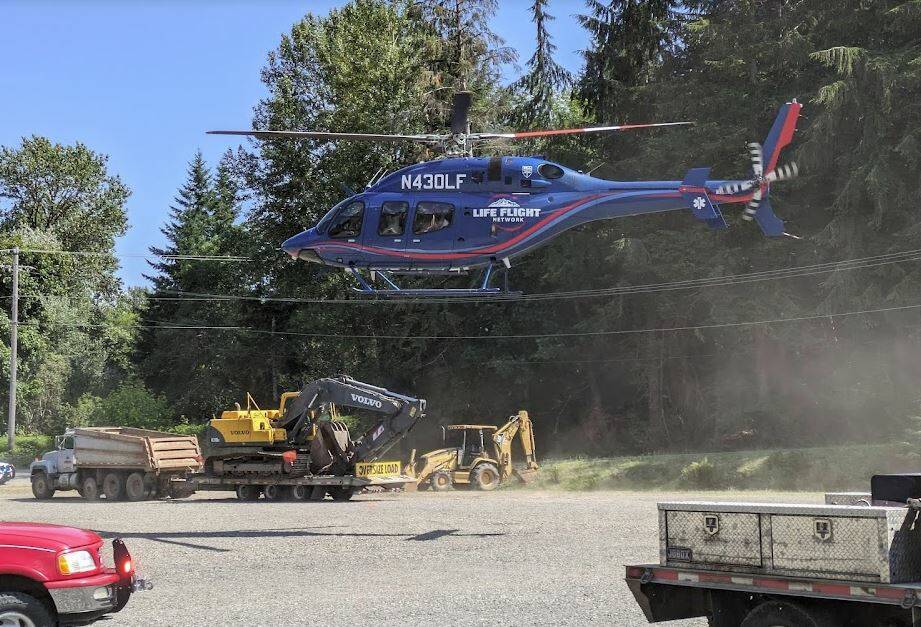 A medical airlift helicopter prepares to land near the scene of an accident south of Forks on Saturday afternoon. A Seattle man who was involved was airlifted to Harborview. Submitted Photo