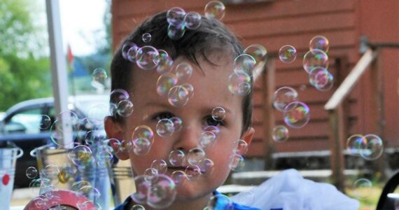 The Forks Elks Lodge held its annual Kid’s Hoe Down on Saturday, Aug 5 at the Lodge on Merchant Rd. The activity is funded through a grant and many activities were upgraded this year.
Three-year-old Hayden Ersband found this bubble machine to his liking Saturday afternoon at the Elk’s Hoedown. More photos on page 3. 
Photo by Lonnie Archibald