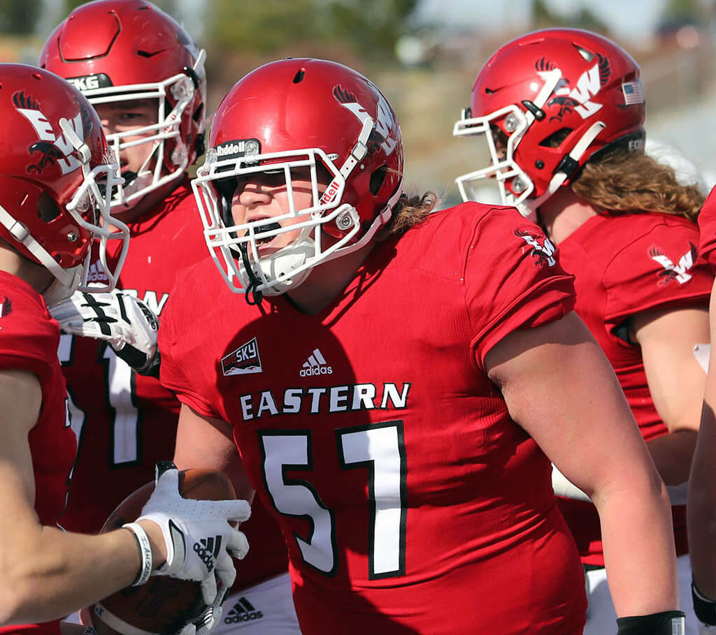 Eastern Washington Athletics Forks’ Luke Dahlgren (57), gets pumped up with a teammate before an Eastern Washington football game. Dahlgren has been named one of four team captains by team coaches ahead of his redshirt senior season.