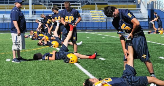 Spartan assistant coach Rob Rogers conducts exercises in preparation for the upcoming football season. Forks is scheduled to play Sequim at home on 
Friday, Sept. 1 beginning at 7 p.m., at the new Spartan Stadium. 
Photo by Lonnie Archibald
See story page 7