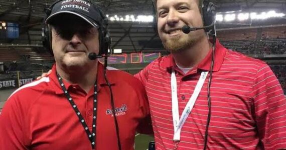 Dave Montgomery, right, is seen here at the Tacoma Dome broadcasting the Neah Bay State Championship football game with Oly Archibald on Forks Radio. Submitted Photo