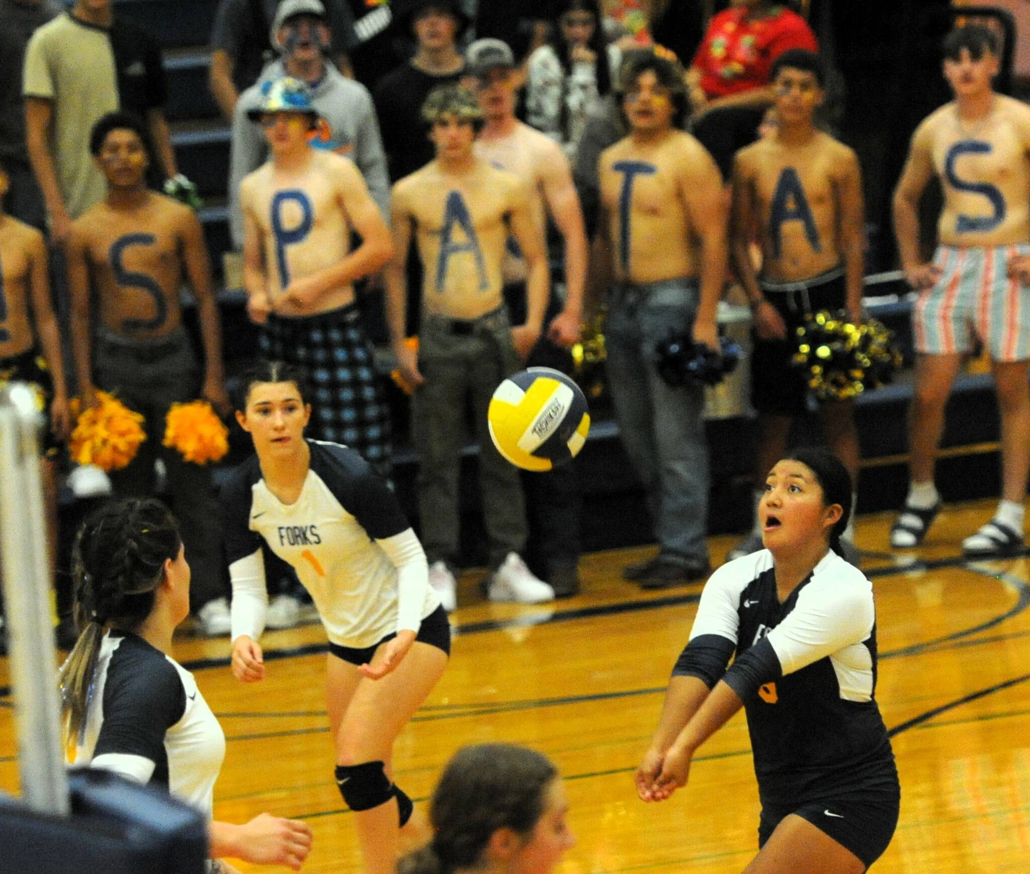At left: Spartan Elizabeth Soto hits while teammates Kaidence Rigby, Erika Williams, and Chloe Gx2aydeski-St John along with Spartan rooters look on. 
Photo by 
Lonnie Archibald