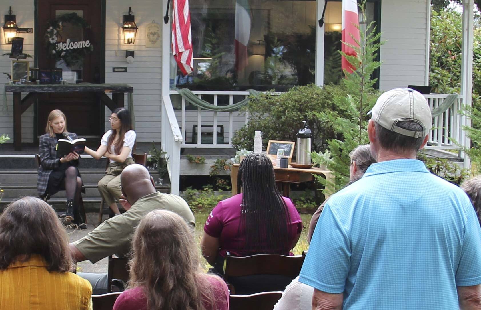 Author M.B. Thurman reads from her debut novel, Summoned, in front of the Miller Tree Inn, aka the Cullen House, during a pre-FTF event last Tuesday. M.B. (Mary Beth) and her husband Trent own the Inn. The FTF Festival also featured other authors at several other venues throughout the celebration. Photo Christi Baron