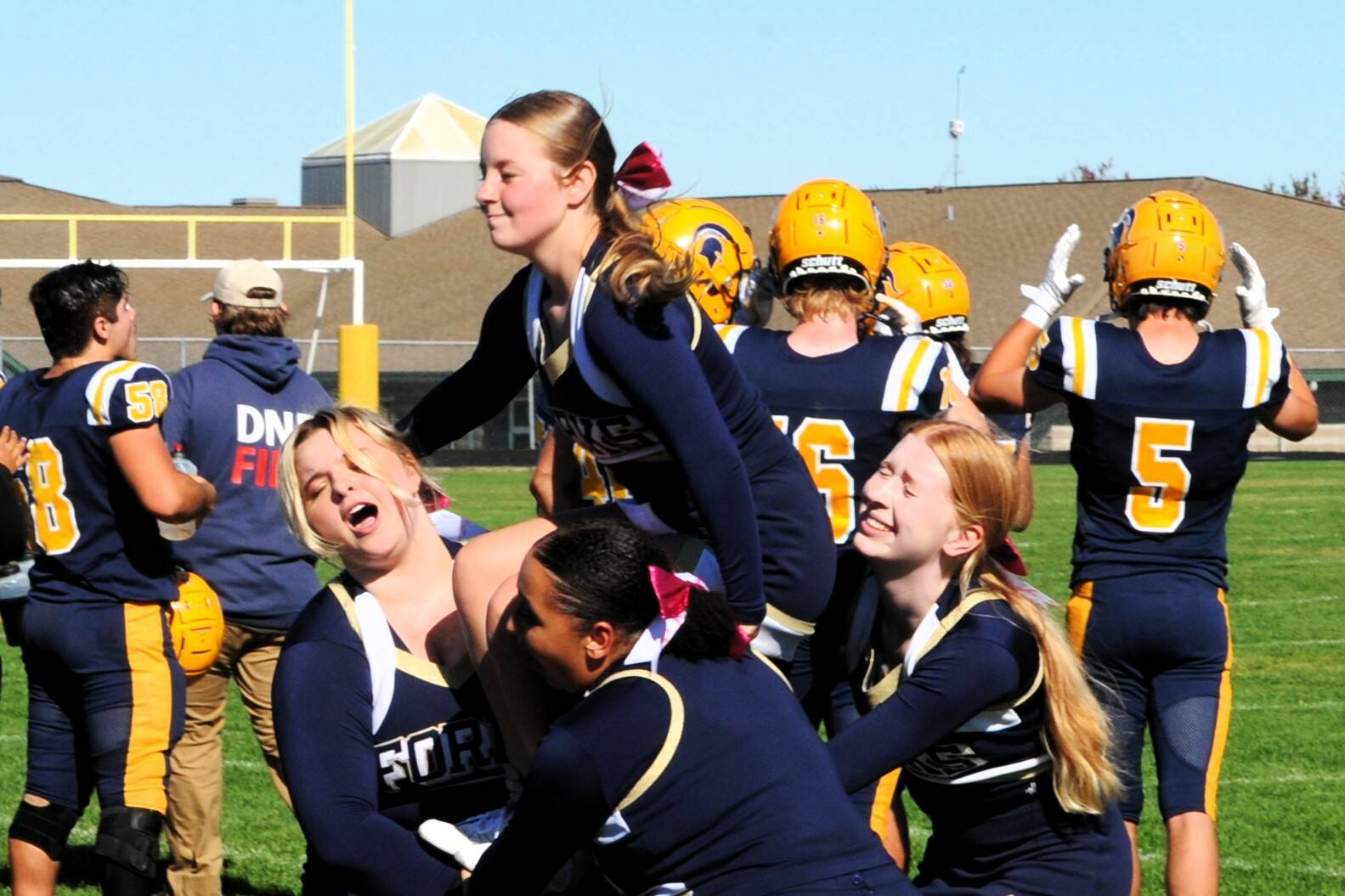 It takes some strong-willed cheerleaders as is pictured here Saturday in Sequim where a portion of the Forks squad showed determination as they went through their routines. Photo by Lonnie Archibald