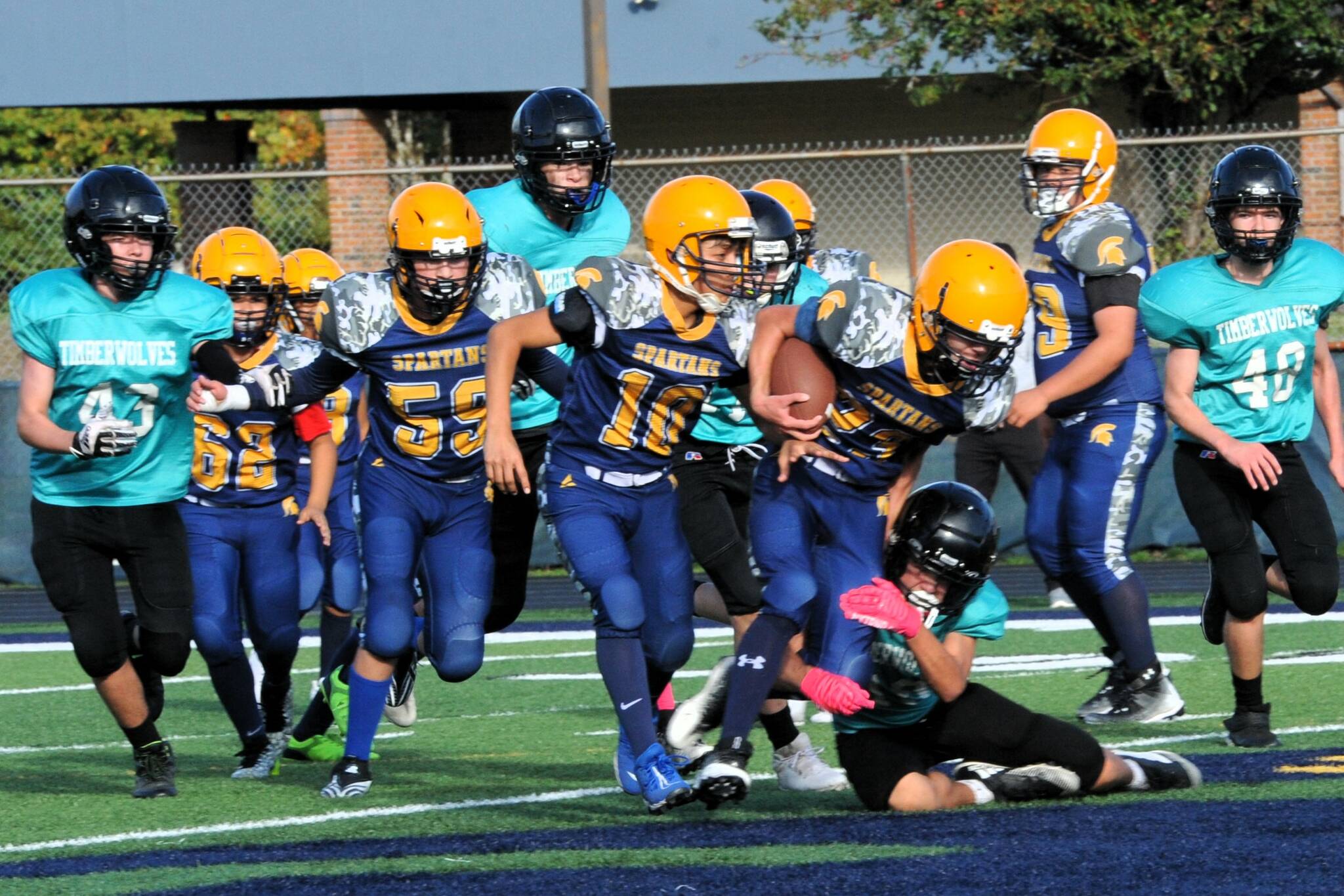 In Forks Junior High action Kingston Steffen powers his way through the Sequim defense. Also in the action for Forks are, from left, Andres Silva, Adon Arrellano, Pedro Francisco, and Yovany Lopez. Photo by Lonnie Archibald