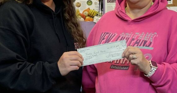 Forks Emblem Club #488 donated $250 to the Forks Food Bank on Oct. 3. Sena Engeseth from the Forks Food Bank is seen here accepting the check from Emblem Club member Teri Leavitt. Submitted Photo