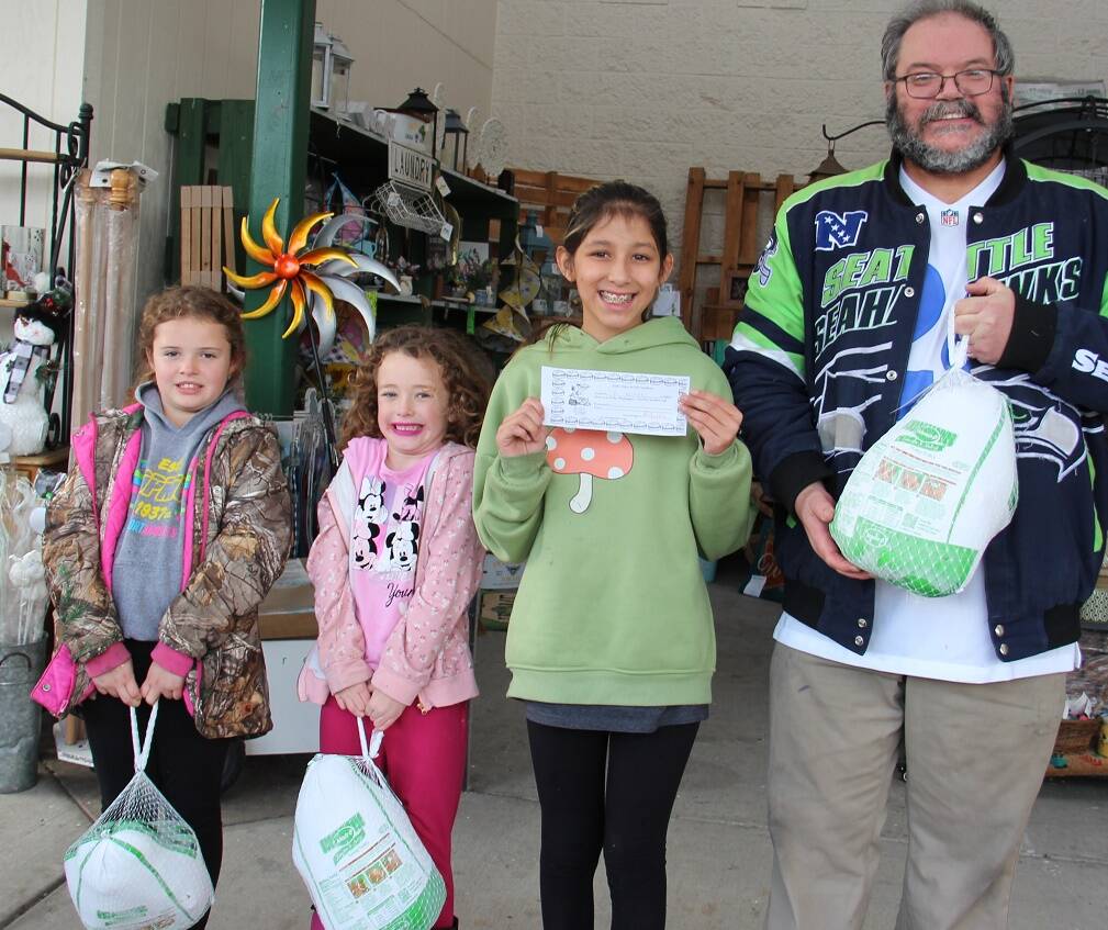 West End Business & Professional Association kicked off the Holiday Season with the first Turkey Drawing last Saturday. Sally Jo Baker and Eliza Hull won turkeys, Jayden Ceja won a Sullys Gift Certificate and Ed Stringer also won a turkey. Also winning Sullys Certificates and not pictured were Elizabeth Kosz-Cleveland and Lisa Bishop. Remember to bring your blue tickets next Saturday when three more turkey winners will be drawn. Photo Christi Baron