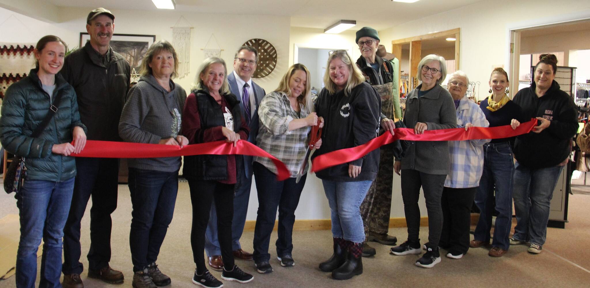 Chamber members, Ginger’s Closet and Disaster Relief Board members, and volunteers gathered last Friday afternoon for a Forks Chamber of Commerce Ribbon Cutting Ceremony. Center photo Executive Director of Ginger’s Closet Layla Rawls and Executive Director Forks Chamber Lissy Andros cut the ribbon. In the photo (L-R)Kari Larson, Bruce Paul, Lori Crippen, Desi Dilley, Mark Gustafson, Rawls and Andros, Gil Olson, Linda Keen, Linda Wells, Tiffany Straza, and Sena Engeseth.
After a 10-month closure during COVID, a renaming, and a new opening at 170 Sol Duc Way the non-profit has been busy. So far this year they have given over $9,500 in cash aid and over $20,000 in voucher credit. Photo Christi Baron
