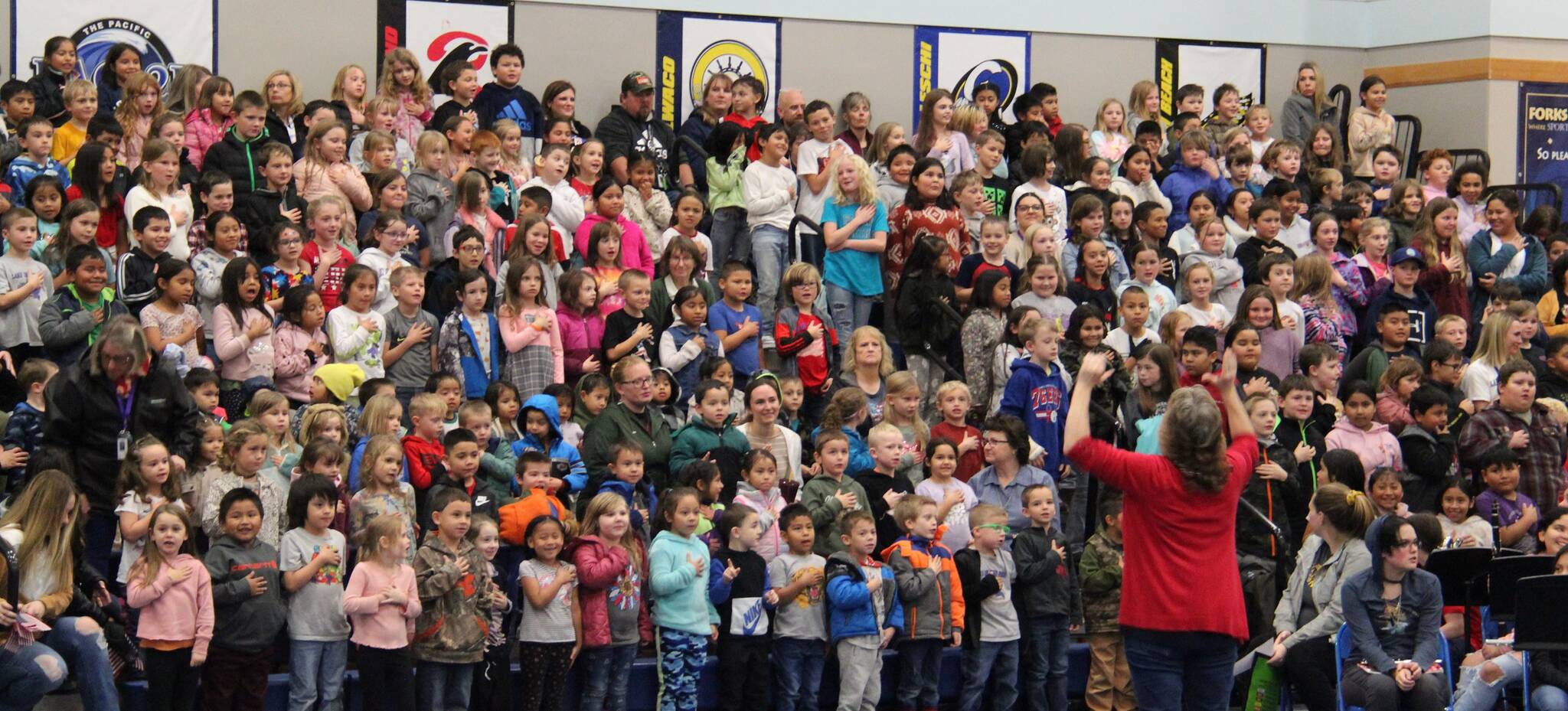 The youngest students offered a rousing rendition of the Pledge of Allegiance, under the direction of Becky Murrillo. Photos Christi Baron