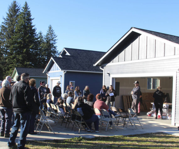 Sunny skies welcomed new homeowners as they were joined by area contractors, family and friends, and Peninsula Housing Authority staff here in front of 481 Maloney Lane; one of the five new homes recently completed and ready to move in, just before Thanksgiving. Photos Christi Baron