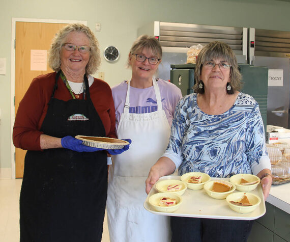 <p>Feeding 5000 volunteers Sherry Schaff, Christie Stallman, and Debbie Anderson show off some of the desserts offered at last week’s Free Lunch at the Forks Community Center. </p>
                                <p>Photo Christi Baron</p>