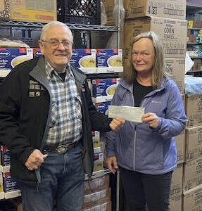 Forks Elks Lodge #2524 member Glenn King recently presented Forks Food Bank Executive director, Pat Soderlind, with a check for $1,500. The funds will be appropriated for future holiday food baskets. In addition to being an Elks member, King is also a Food Bank volunteer. Submitted photo