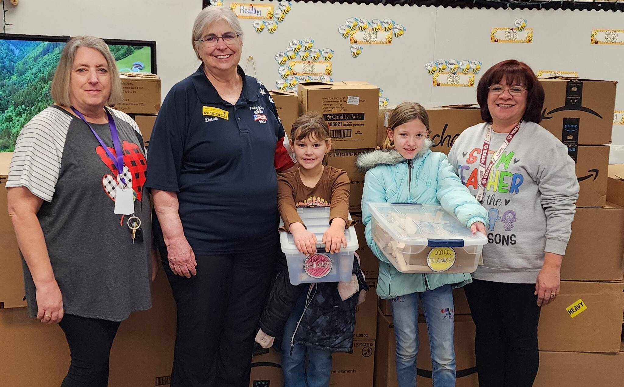 Recently Forks Elk’s ER Dawn Harris presented a $4000 check from a grant from the Elks National Foundation to Forks Elementary School, benefiting their STEM and STEAM programs.
Displaying the boxes are Aaliyah and Emory Millett with School Librarian Cathy Johnson and Educator Dora Maxfield.
Sensory bins offer an opportunity for children to explore and learn through their senses. This can increase their language skills, fine motor skills, social skills and hand-eye coordination. Submitted photos