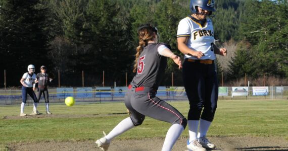 In their first home game of the season, Forks defeated Hoquiam 20 to 15 in a slugfest at the Fred Orr Memorial Park in Beaver. Forks is scheduled to play Montesano on Thursday, March 21 also in Beaver. The Spartan JV team lost to the Grizzlies 15 to 11. Forks Elizabeth Soto beats the throw to third. Photo by Lonnie Archibald