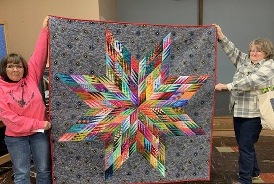 Vicki Queen and JoAnnn Lawson are holding Piecemakers Quilt Club’s raffle quilt. Tickets are available from club members, at the quilt show and some weekends at Forks Outfitters. Tickets are $2 each and the drawing will happen Sunday, April 21. Submitted photo