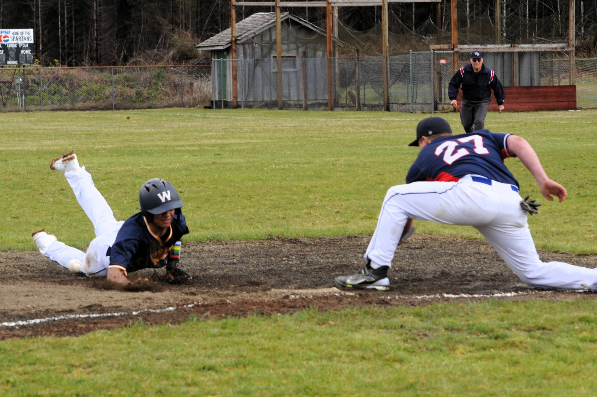 Bubba Hernandez Stansbury steals third base during the first game of the doubleheader. Photo by Lonnie Archibald