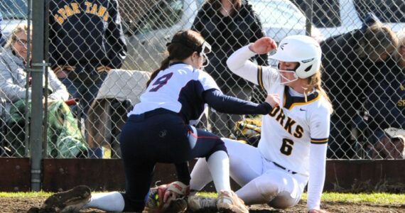 Spartan Molly Hampton was safe at home during the first game of the double header with Pe Ell. Photo byLonnie Archibald.
