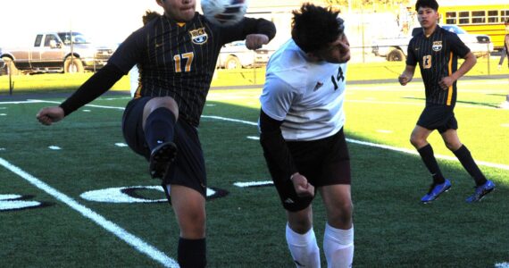 Spartan Kevin Udave Ramos (17) competes with Ravens Michael Numez for ball control on April 17 at Spartan Stadium where Raymond/South Bend defeated Forks 1 to 0. Looking on is Forks Mateo Lucas. Photo by Lonnie Archibald