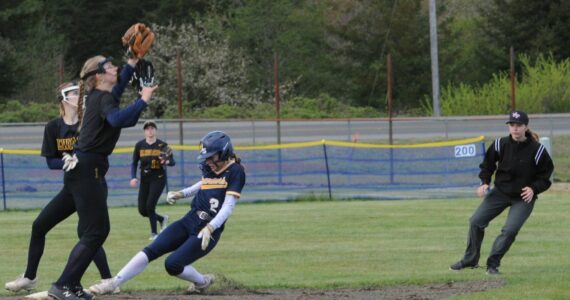 Forks’ Karee Neel steals second base against Ilwaco who Forks defeated 11 to 0 and 15 to 2 in this double header played at the Fred Orr Memorial Park in Beaver. Photo by Lonnie Archibald